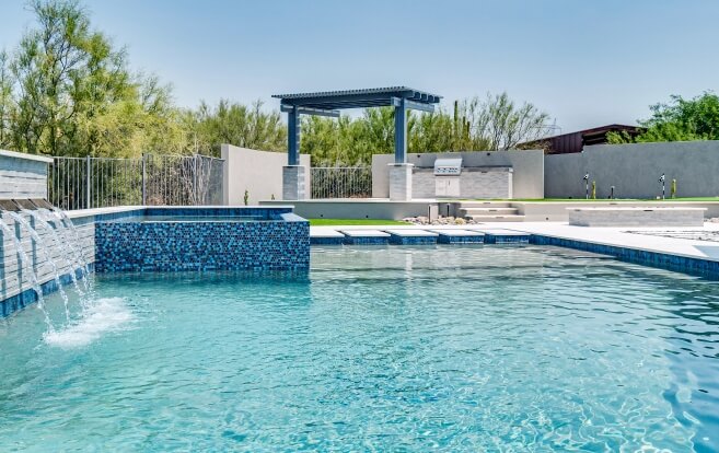 Excavated Phoenix backyard with steel framework in place for a new custom pool