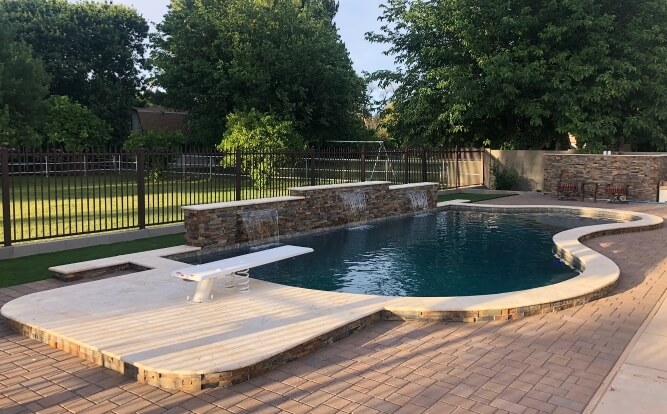 Finished custom Phoenix pool with new tile, decking and interior finish