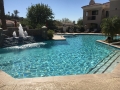 Cantera stone alternative water feature on a custom pool by True Blue Pools