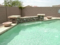 Custom remodeled pool with scupper water fountain in Mesa by True Blue Pools