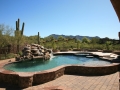 Raised custom pool spa with waterfall — True Blue Pools (36)