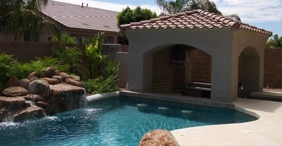 Pool With Waterfall and Sunken Bar in Phoenix