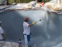 pool building pebble surface