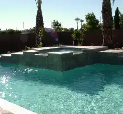 Stylish pool remodel with elevated spa and tile accents in Phoenix