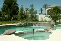 Professionally built swimming pool with integrated spa and waterfall