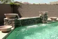 Custom Phoenix pool design with water features built by True Blue Pools experts